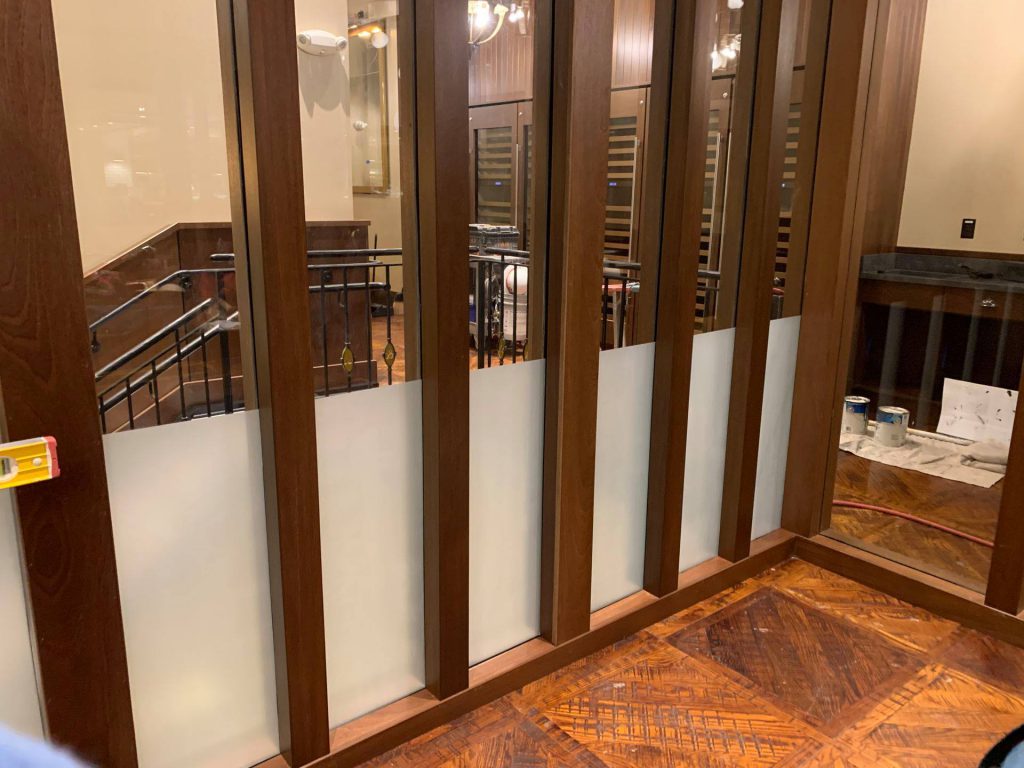 Frosted decorative film band on interior glass partitions in a Las Vegas commercial space