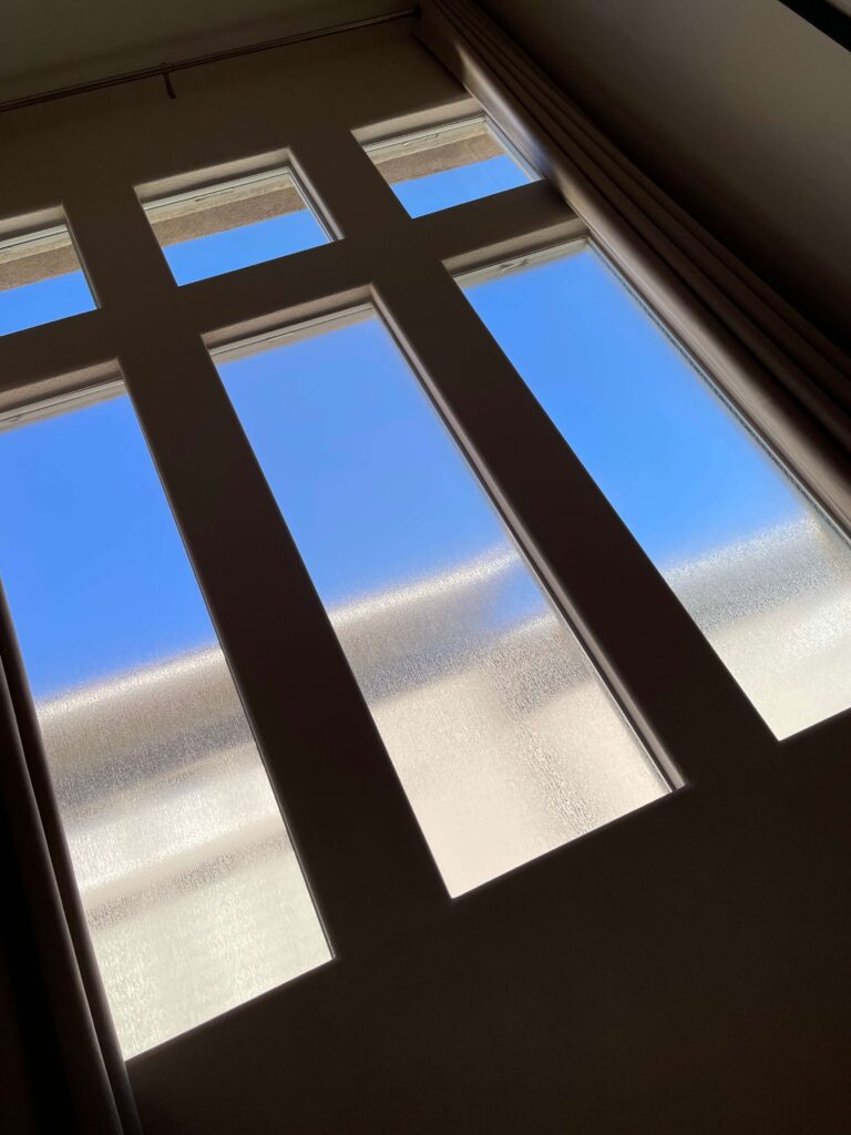 Window film that obscures the lower glass while keeping a clear view of the sky above